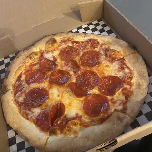 a pepperoni pizza in a box
