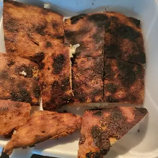 Burned bottom of our pizza.