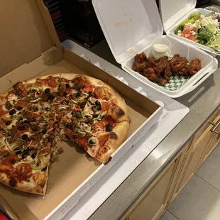 Loaded pizza, chicken, greek salad all terrific.