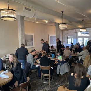 a large group of people sitting at tables