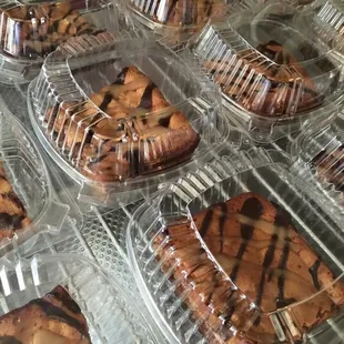 a variety of pastries in plastic containers