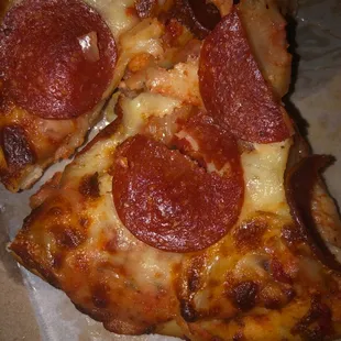 two slices of pepperoni pizza
