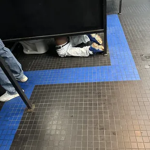 Mens Restroom.... Why are the pants down if you are ???