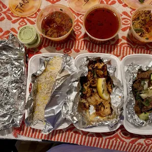 From Left top clockwise Beef Balti Special, Nihari Special, Mixed Vegetables, Beef Seekh Kabob, Chicken Malai Tilka and Rice/ Naan