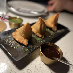 Veggie samosa with red and green chutney