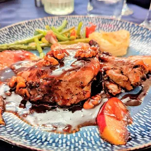 Duck confit with pack and walnut sauce