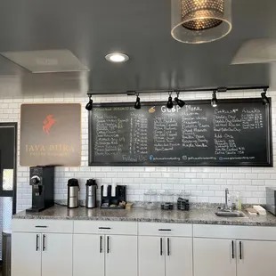 Behind the counter with wall menu