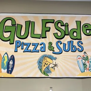 a sign for gulfside pizza and subs