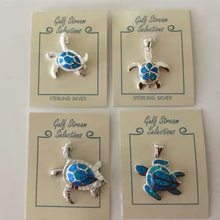 Lab opal sterling silver turtle pendants in a variety of styles.