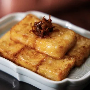 a square dish of food on a table