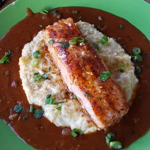Blackened salmon etouffe with cheesy grits