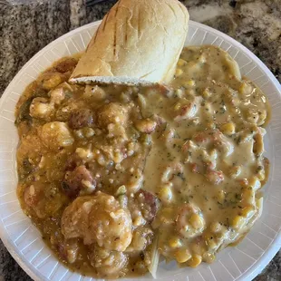 Half lobster/shrimp etouffee and half crawfish maoue choux