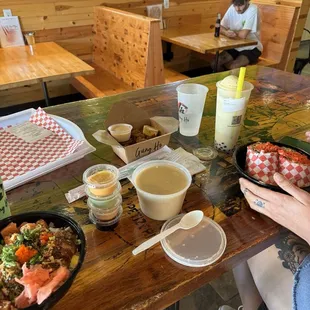 Ramen broth, flaming poke burrito, karate chicken, poke bowl, boba float, and honey dew drink