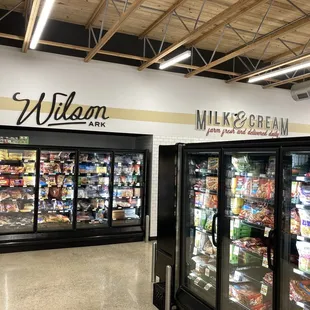 some of the coolers inside of the store