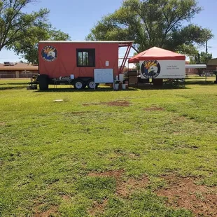 a red trailer and a white trailer