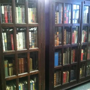 Fancy books in glass cases.