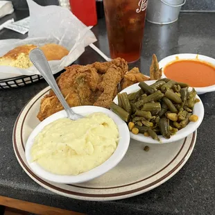 Fried chicken, green beans and mashed potatoes.
