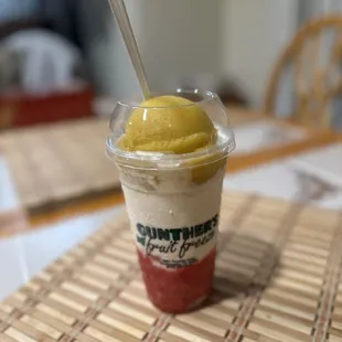 Large 50/50 Freeze 24oz with mango and strawberry banana sherbet plus banana ice cream in the middle