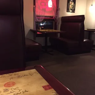 a dining area with a table and chairs