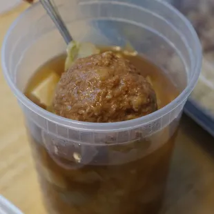 a plastic cup filled with food