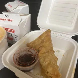 Samosa with some kind of berry sauce