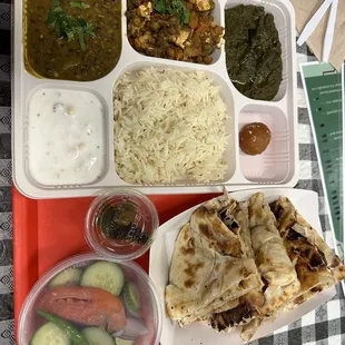 Combo thali - 1 dal, 2 sabzi, raita, naan (roti option available), rice, salad, achar, dessert