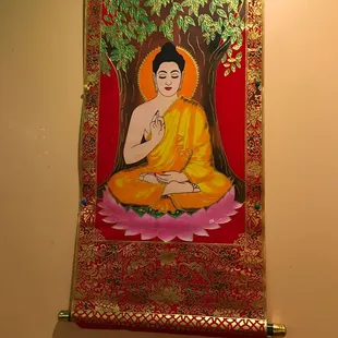 a painting of a seated buddha