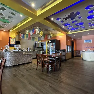 a large dining area with tables and chairs