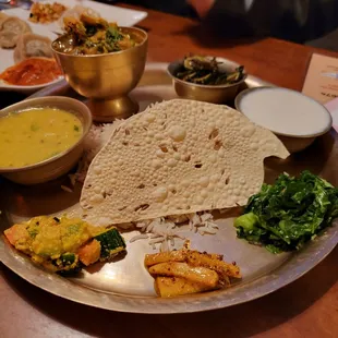 Thakali thali set, with dal, rice, veggies and khir