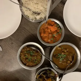Chicken Tikka Masala, Bhindi Masala, Goat Curry, eggplant dish with peas, Naan, Rice