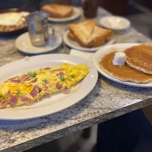 Western Omlette with pancakes and toast