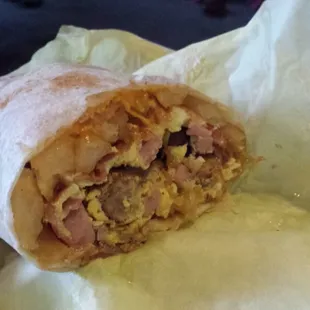 Breakfast burrito w/ all the meat,(ham, sausage, &amp; bacon), eggs and fires!!