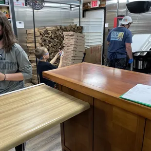 Firewood and right side behind counter.