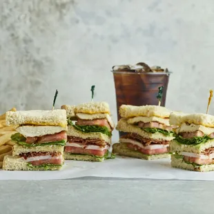 a stack of sandwiches and french fries