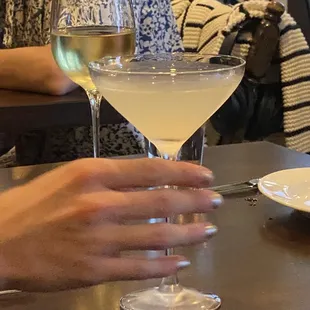 a woman holding a glass of wine