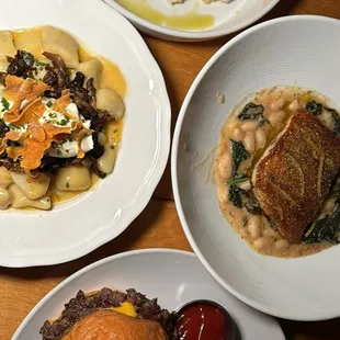 three plates of food on a table