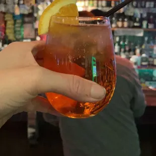 a person holding a drink
