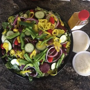 Large Greek Salad with Feta on the side. There was even another hidden layer of toppings! It was perfect