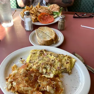 All  meet omelette with cheese and hash Browns my wife got a chicken sandwich with fries well priced good food we will be back here