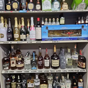a shelf full of liquor