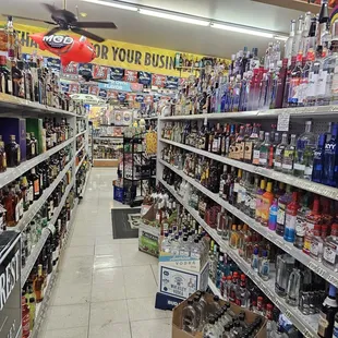 a wide aisle of liquor