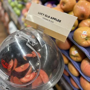 a display of apples and oranges