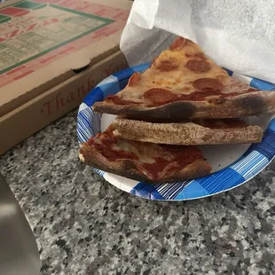 Burnt pepperoni pizza