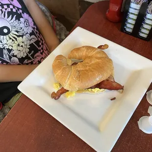 Croissant with egg and bacon.