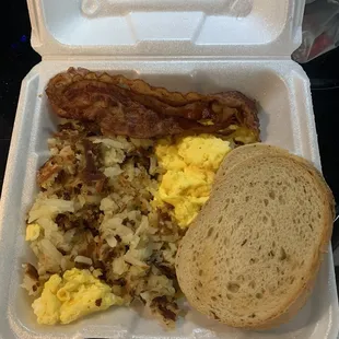 2 Eggs, Any Style (scrambled) hash browns, choice of meat (bacon) and toast (rye)