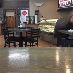 Dessert case, Teevee, and soda machine.