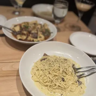 a plate of pasta and a glass of wine