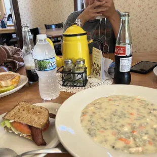 a woman taking a picture of her meal