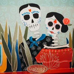 a painting of a man and a woman with sugar skulls
