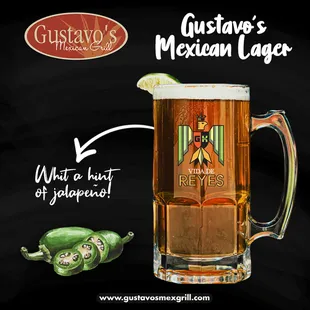 a glass of beer with a slice of lime on top